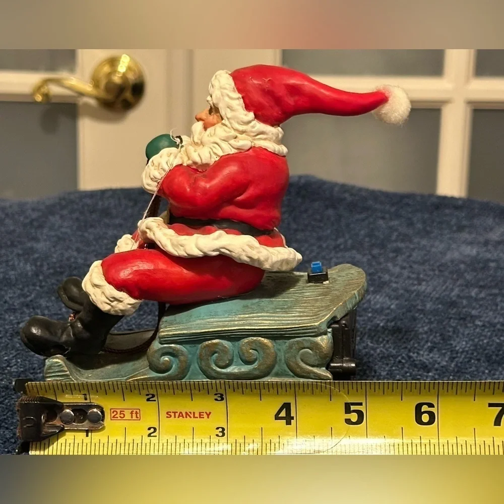 Musical vibrating Santa on his sleigh. Plays 3 songs!